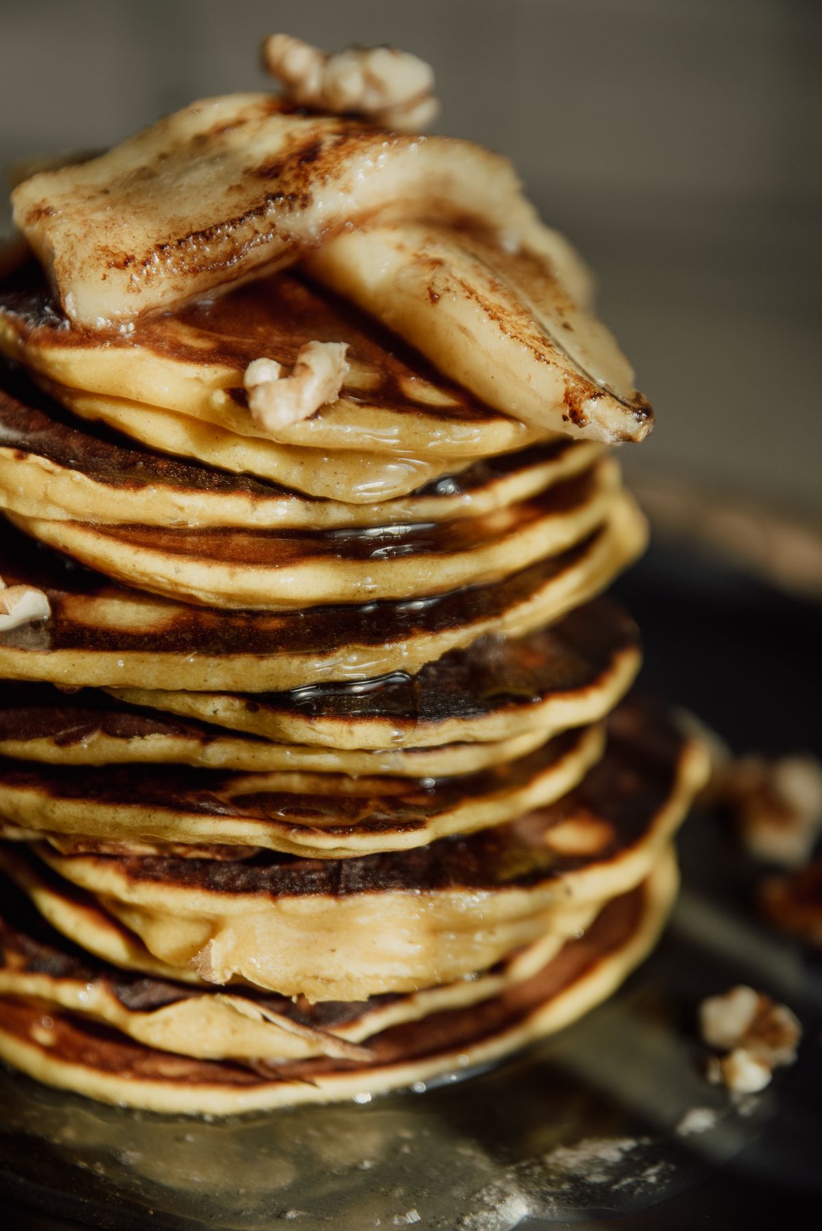 Close-up of a stack of golden pancakes showing their thickness and texture