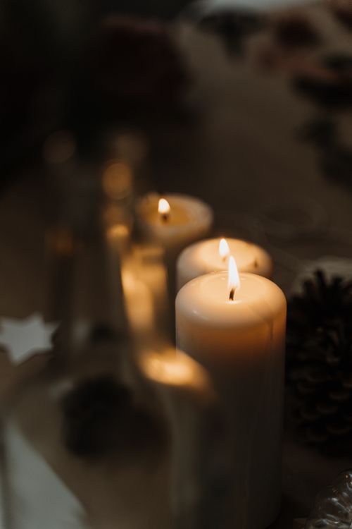 Free Warm and inviting candlelit scene perfect for festive winter decorations or intimate gatherings. Stock Photo
