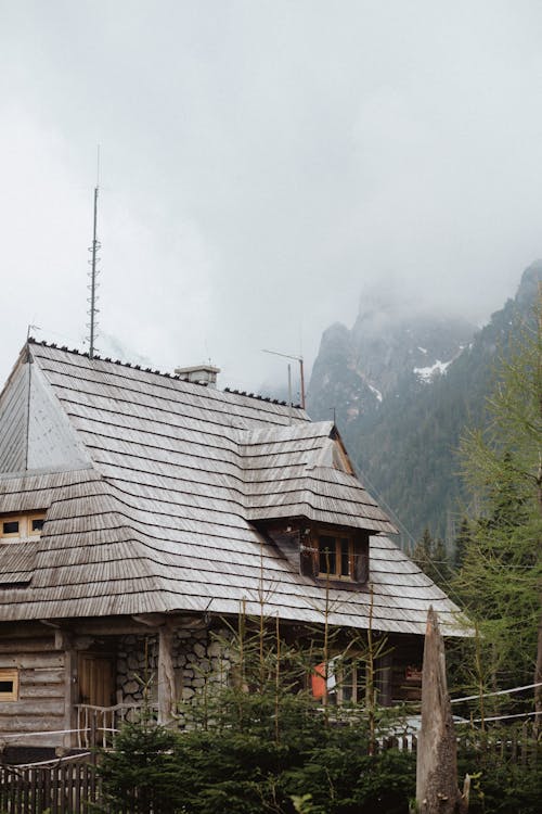 Photo of a Wooden House On A Foggy Day
