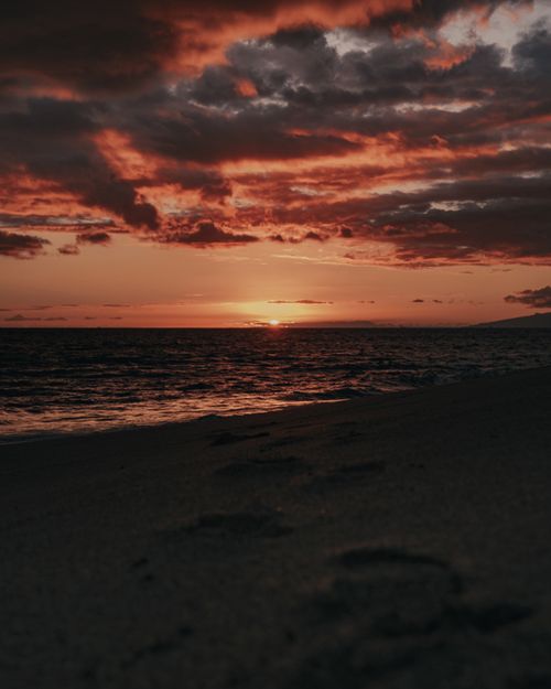 Free Serene seascape featuring a vivid sunset over Santa Cruz beach, Tenerife, Spain. Stock Photo