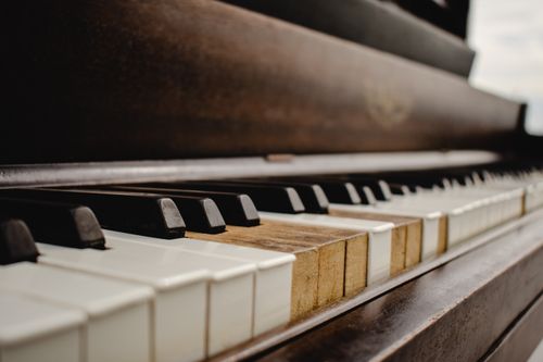 Free Detailed view of vintage piano keys showcasing texture and aging indoors. Stock Photo