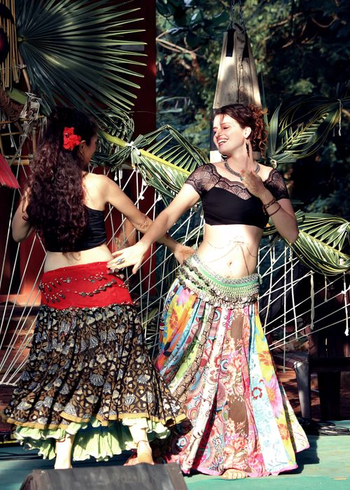 Free Two women in colorful traditional attire perform a lively dance outdoors in India. Stock Photo