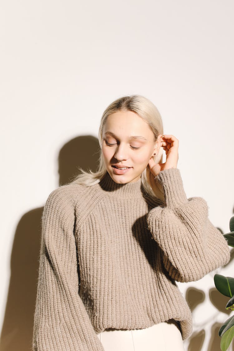 A Woman In A Knitted Turtleneck Sweater