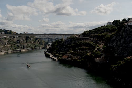 Iron Bridge Above A River Under White Clouds