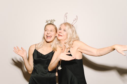 Mother And Daughter in Black Sleeveless Dress And Headdress
