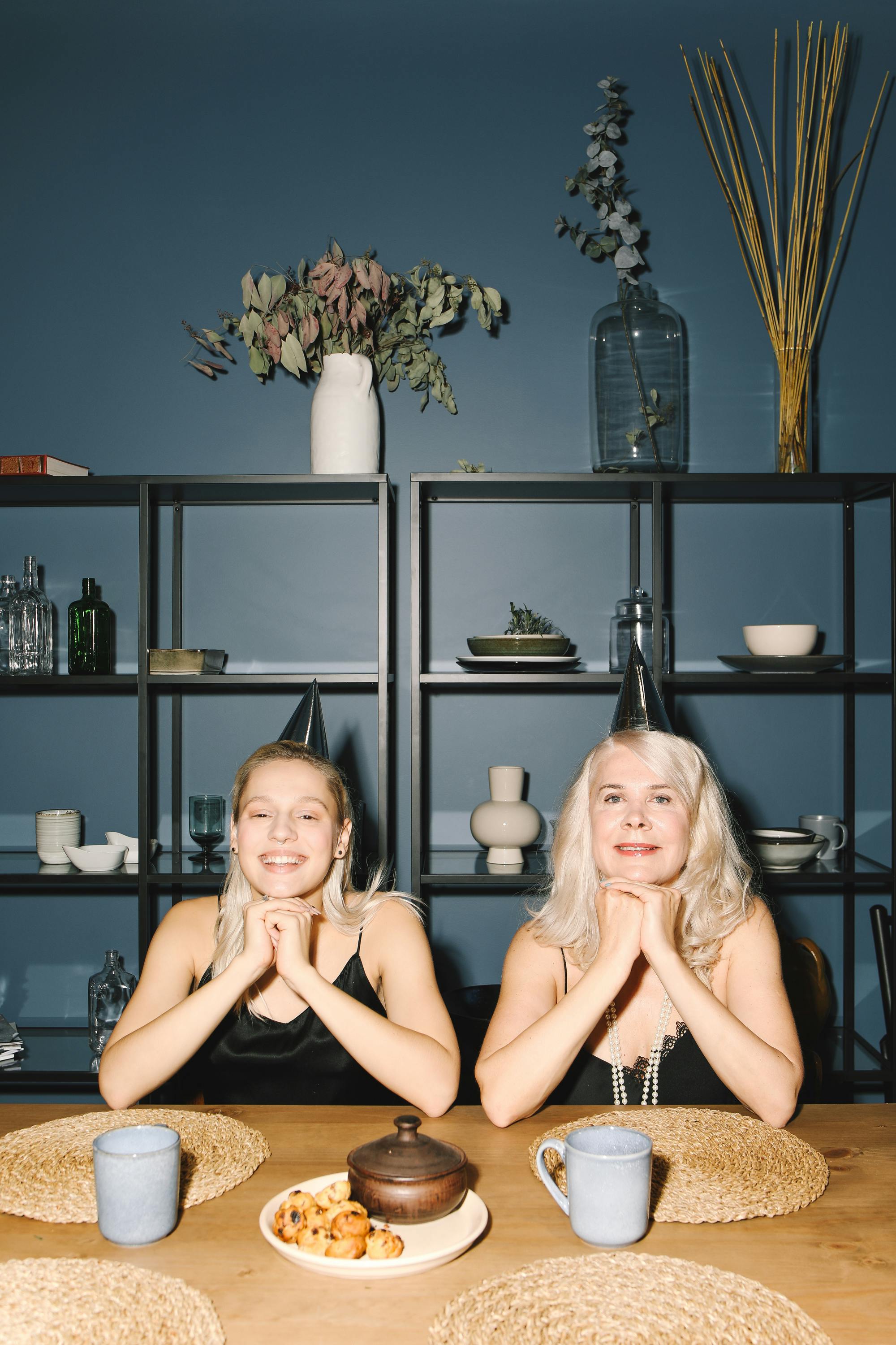 Happy mother and daughter enjoying New Year's celebration indoors.