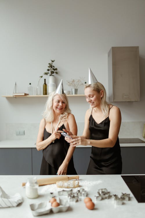 Mother And Daughter Having Fun While Cooking