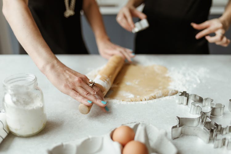 Person Using A Rolling Pin For Baking