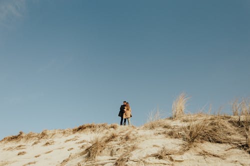 A Couple Standing on the Mountain