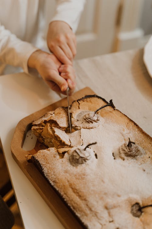 Woman Cutting Handmade Bread 
