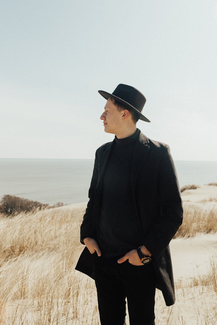 Man Wearing Black Outfit On A Field 