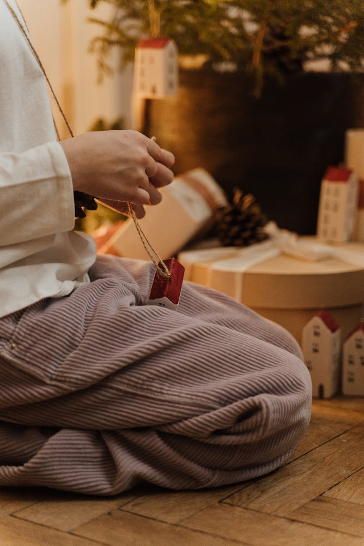 Kneeling Child Opening Christmas Present