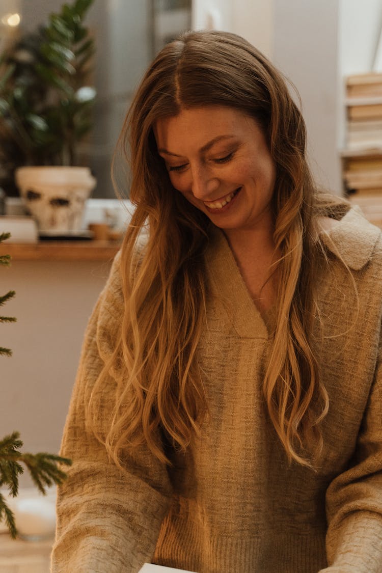 Young Woman Looking Down And Smiling