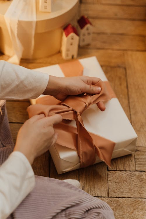 Free Woman Packing a Gift  Stock Photo