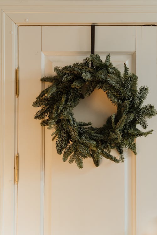 A Christmas Wreath Hanging on a Door