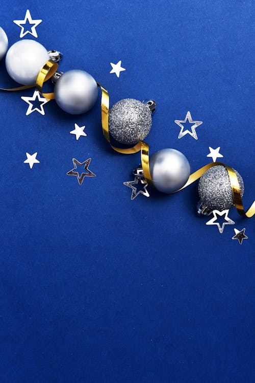Silver Christmas Balls On Blue Background
