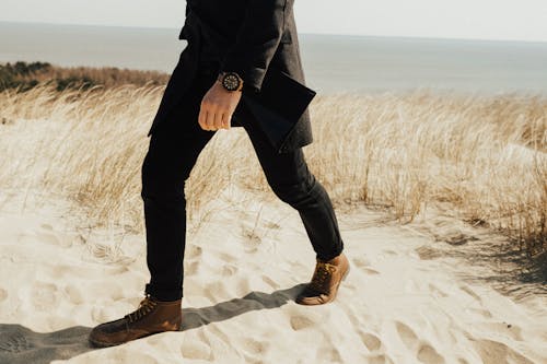Free A Man Walking on Sand Stock Photo
