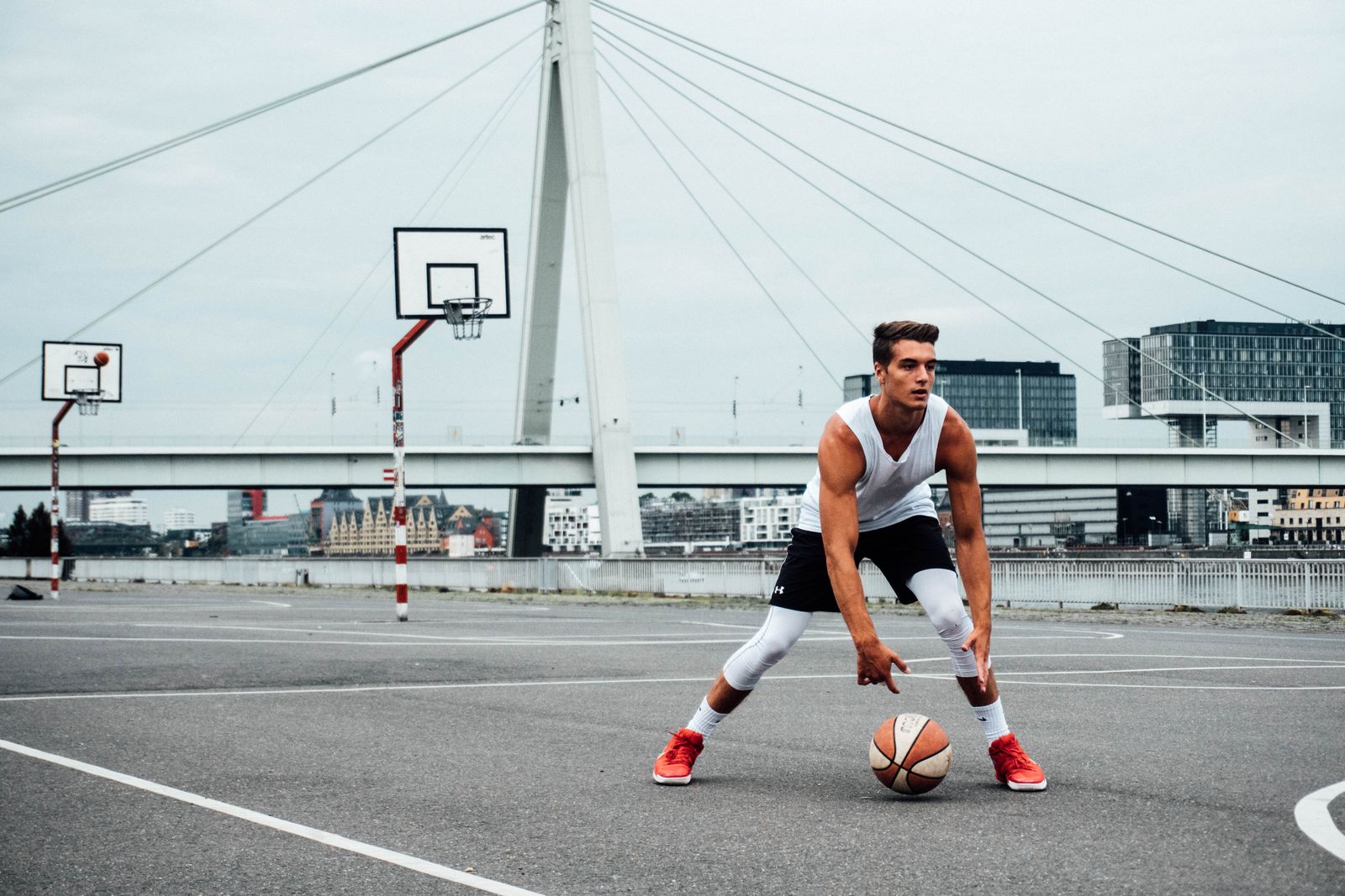 Person adjusting a knee brace before outdoor activity