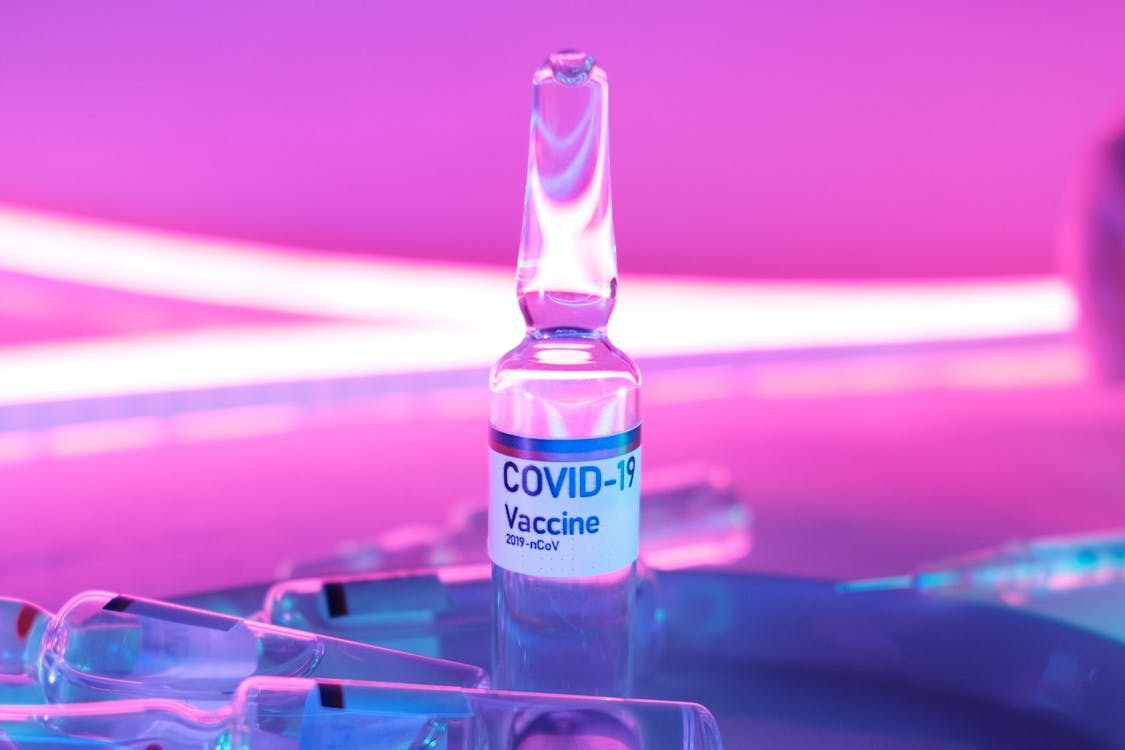 Glass clean ampoule with vaccine for COVID 19