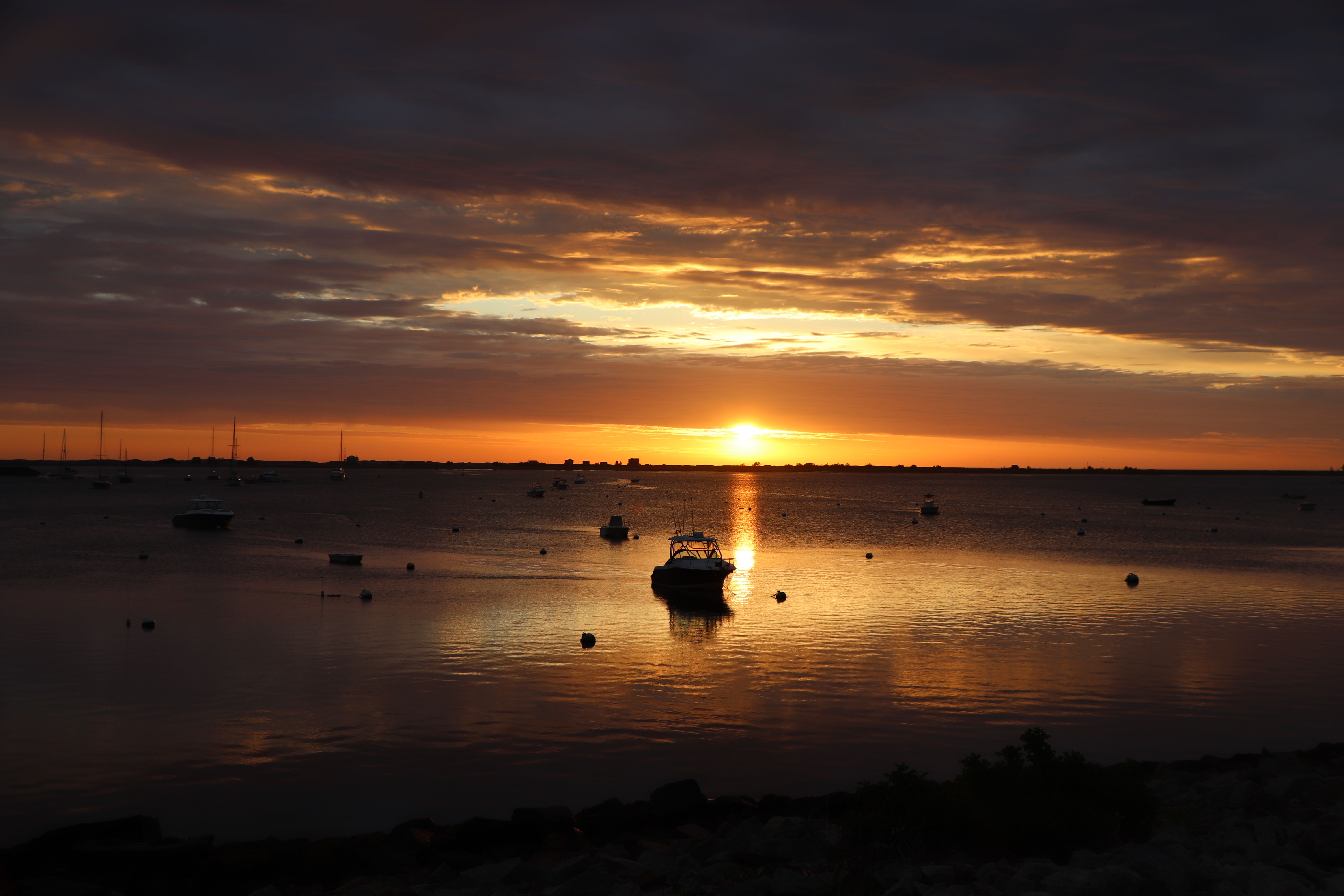 Silhouette of Boats on the Sea during Sunset · Free Stock Photo