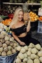 Woman in Black Tank Top Holding Green Fruit