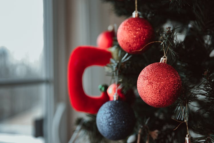 Christmas Tree With Baubles In Room