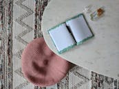 A Top Shot of a Open Journal with a Pen on a Table