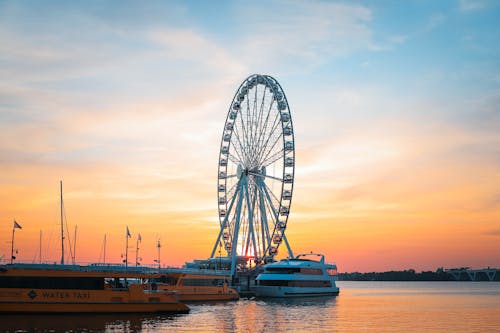 Ferris Wheel Near a Dock