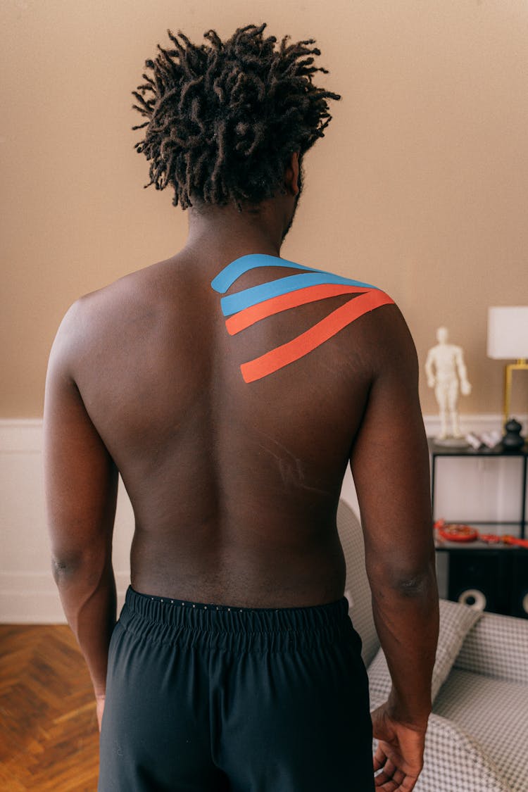 Man With Massage Tapes On Back