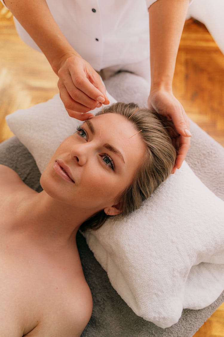 Massage With Needles On Woman Face