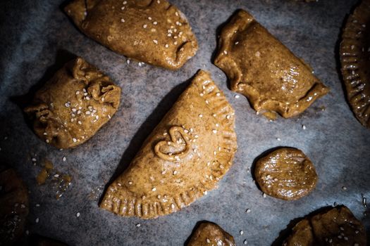 Delicious homemade pastries with a heart detail, baked to perfection on a rustic surface.