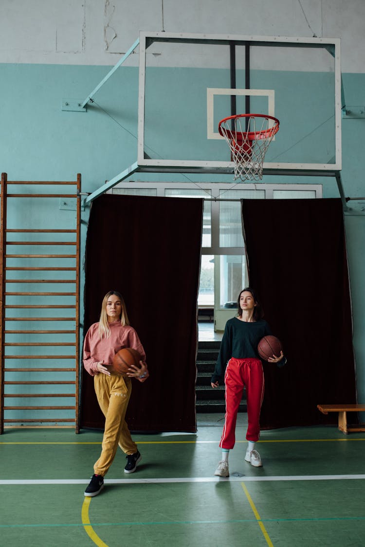 Women In Sportswear At A Basketball Court