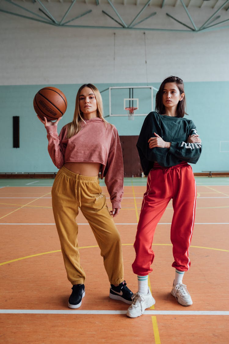 Stylish Young Women At A Basketball Court