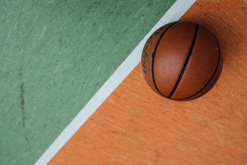 Free Basketball on a Floor with White Line Stock Photo
