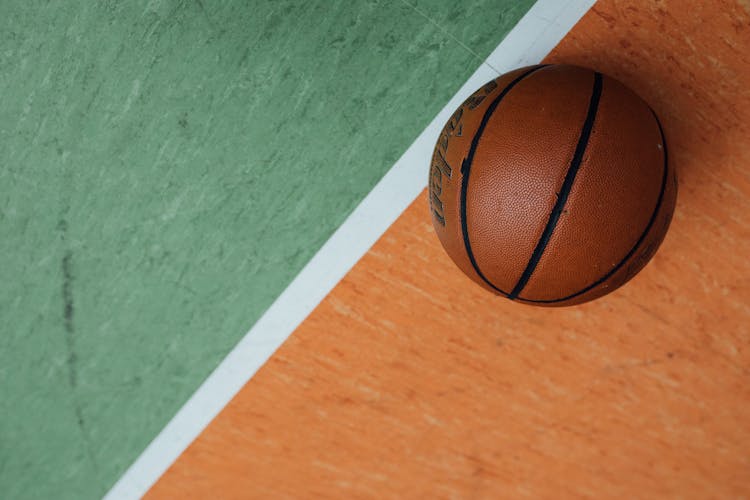 Basketball On A Floor With White Line