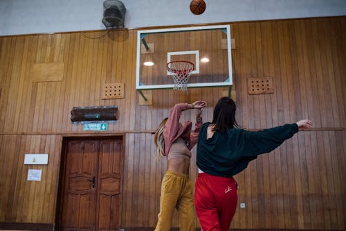 Young Women Playing Basketball
