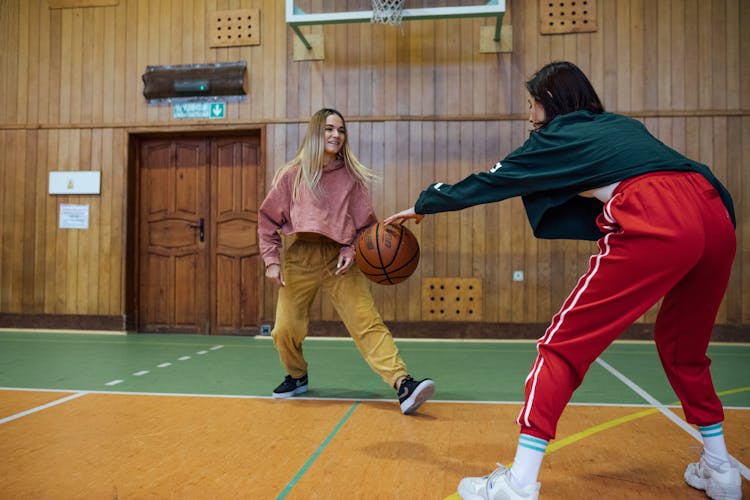 Young Women Playing Basketball