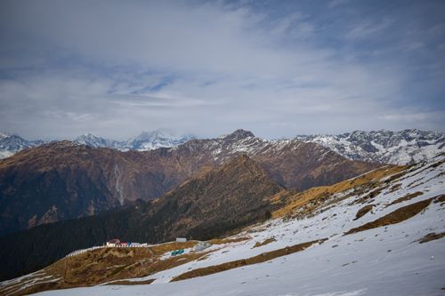 Free Majestic snowcapped mountains with a scenic winter landscape and clear sky. Stock Photo