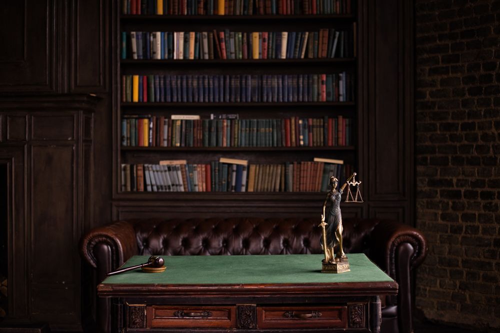 Law library with legal books and scales of justice