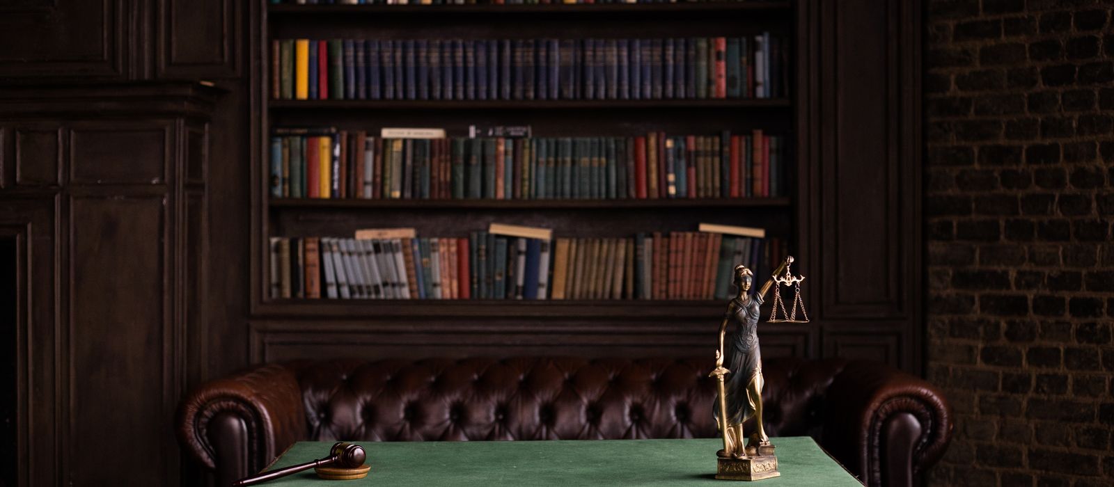 A study with shelves of law books and a desk