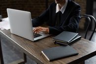 Person Typing on a Laptop