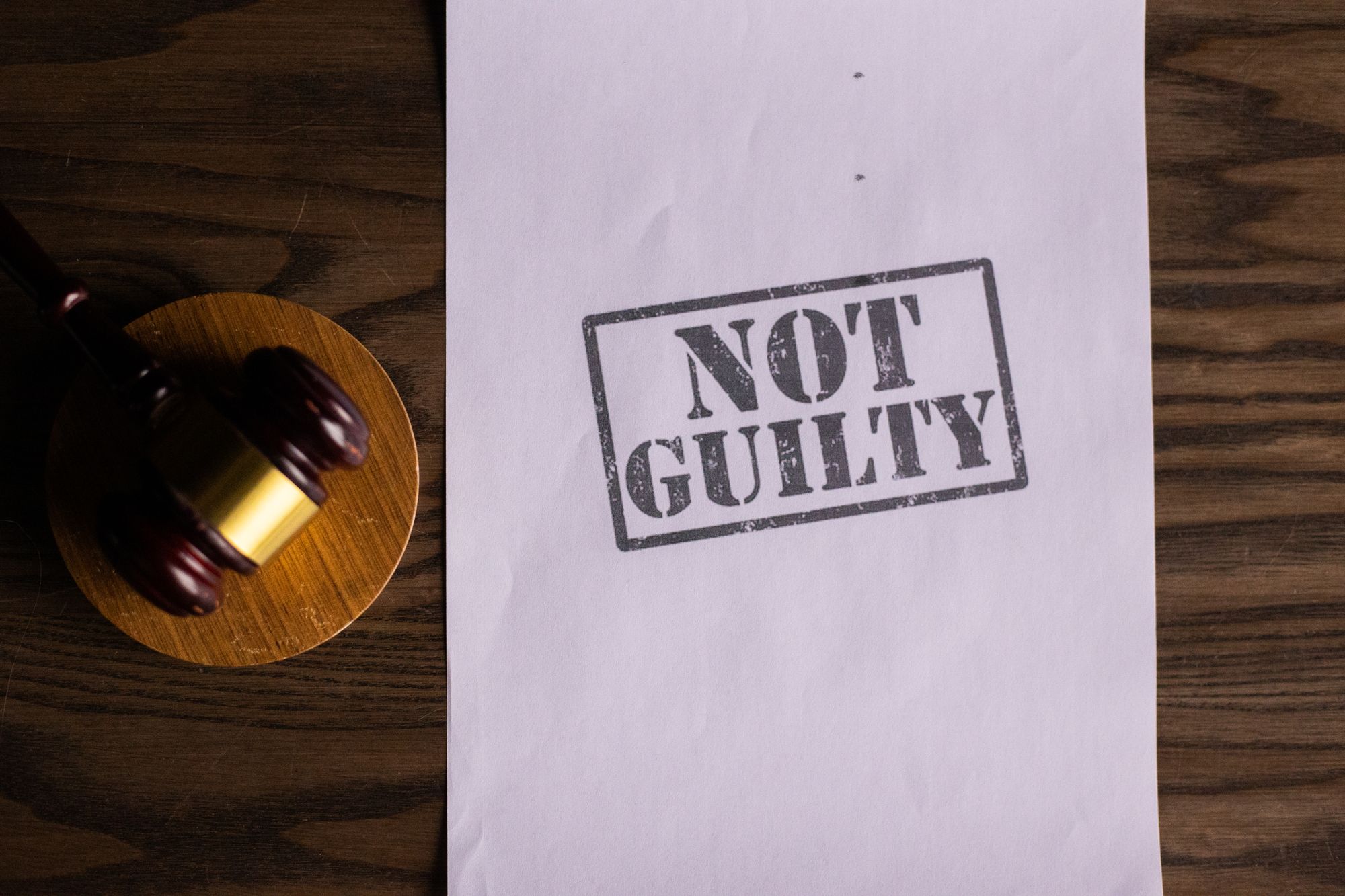 Criminal defence court document with a gavel on a legal desk