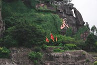 Mountain range with plants and national flags in summer