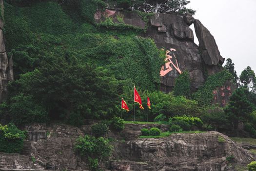 Mountain range with plants and national flags in summer