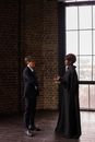A Woman in a Suit Talking to a Judge