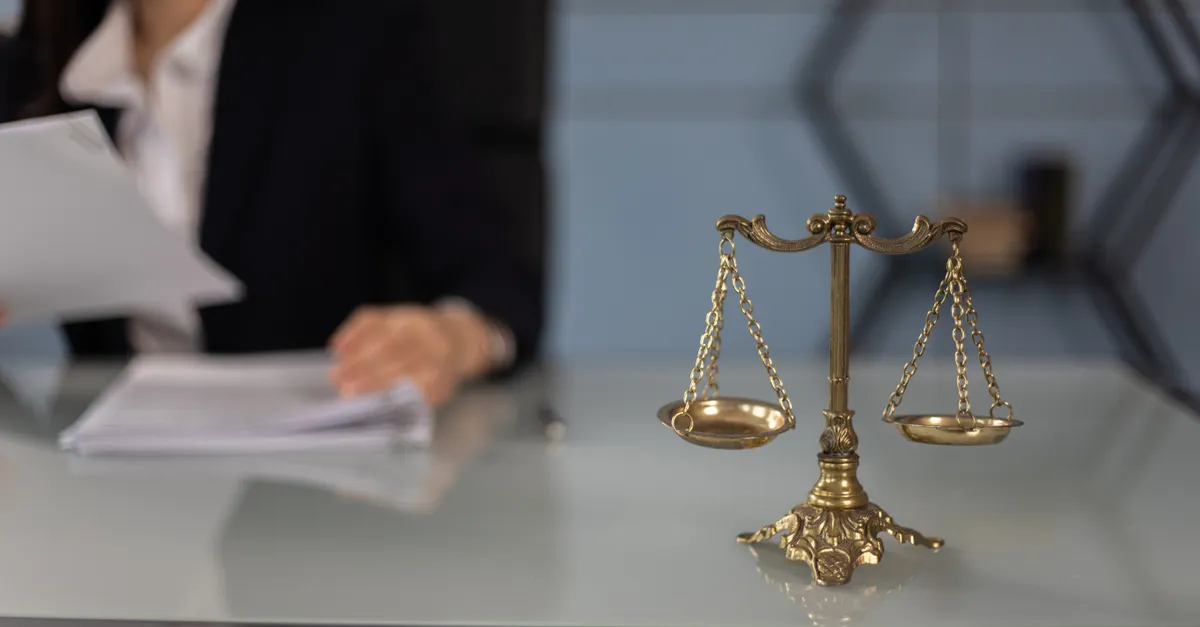 Balance scales on a desk in a professional law office