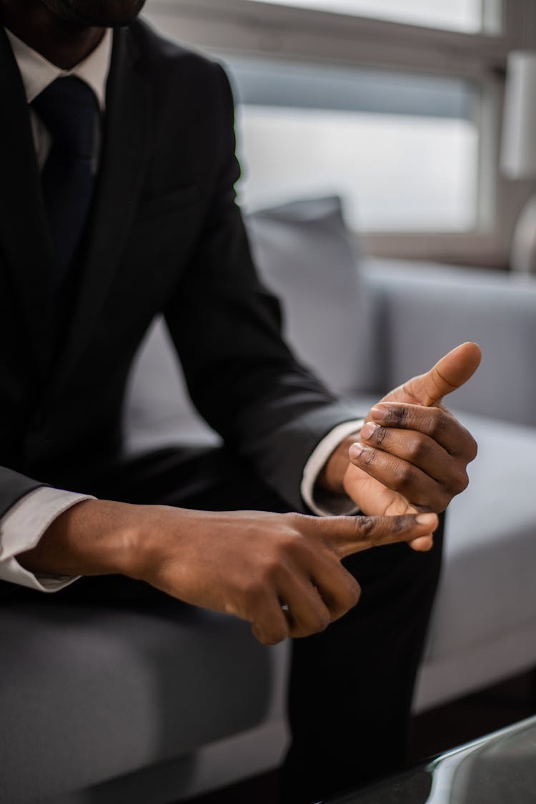 A Close-Up Shot Of A Man Counting On His Fingers