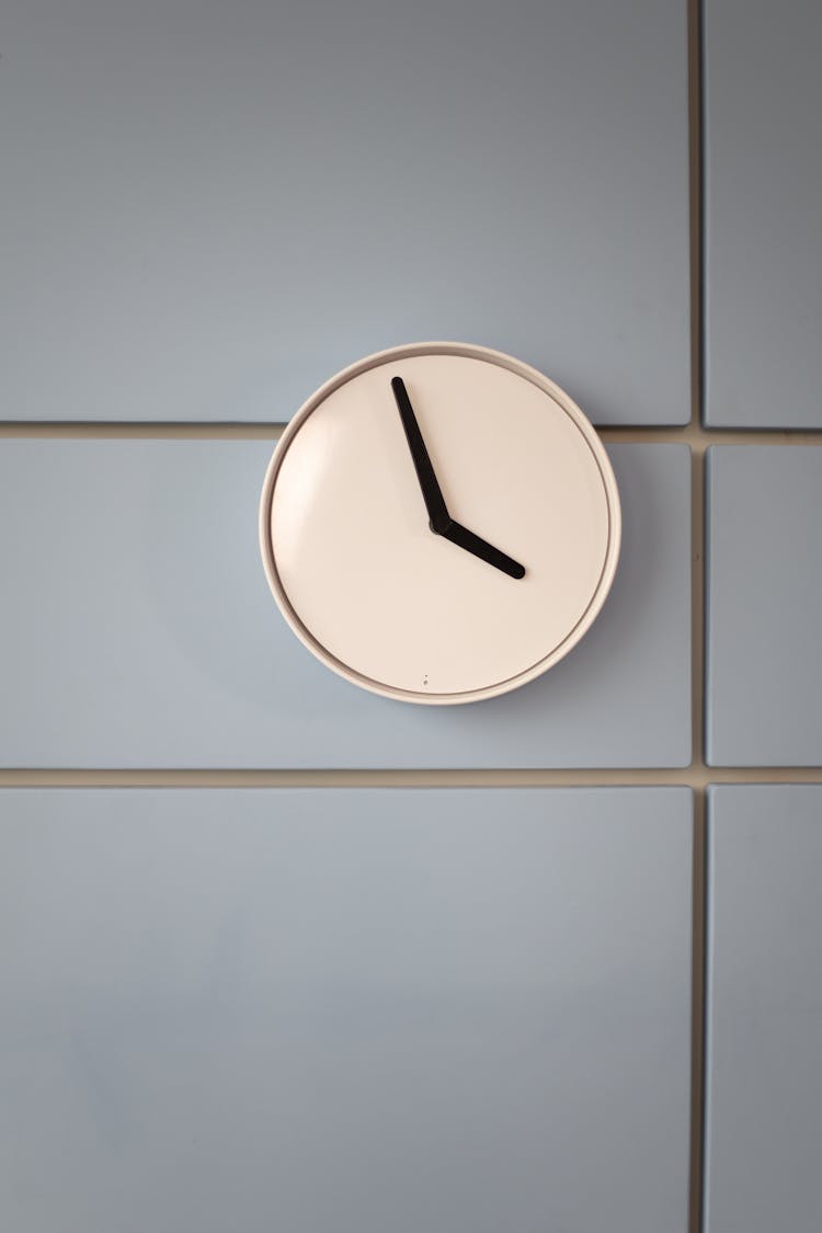 Close-Up Shot Of A Minimalist Analog Wall Clock 