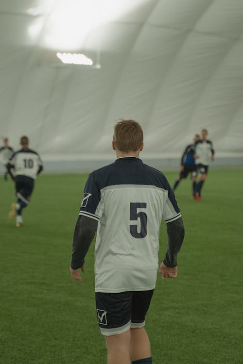 A Man Wearing a Soccer Uniform