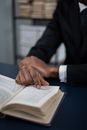 Person in Black Suit Jacket Writing on White Paper